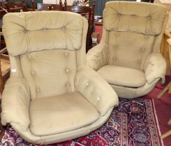 A pair of 1960s pale fabric buttoned upholstered swivel bucket chairs, each with squab cushion and