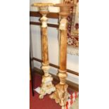 A pair of cast iron freestanding pricket floor sticks, in the classical taste, each with knopped and