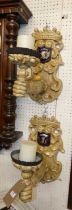 *A pair of decorative Continental painted wood candle wall sconces, each with crown, shield and