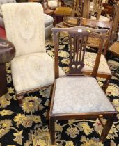 A mid-Victorian rosewood framed and floral needlework upholstered scroll nursing chair, together