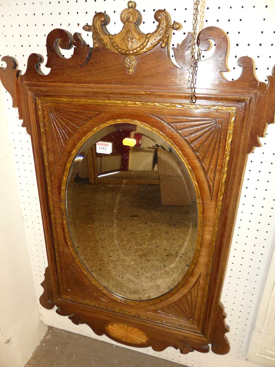 *An Edwardian mahogany and satinwood inlaid Chippendale style fret cut wall mirror, inset with