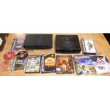 A box containing video game items to include Playstation 2 console, Sega Saturn console, etc