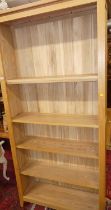 A contemporary blond ash freestanding open bookshelf, with adjustable shelved interior, w.96.5cm