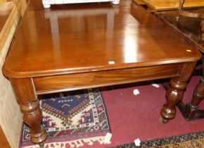 A Victorian and later mahogany round cornered extending dining table, having pull-out action, two