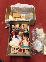 A quantity of dolls house furniture and foreign dolls