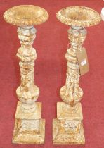 A pair of white painted cast iron torcheres, h.72cm