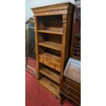 *A contemporary Eastern teak freestanding open bookshelf with twin short central drawers, width