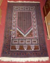 A Persian woollen prayer rug, the central geometric motifs within trailing tramline borders, 145 x