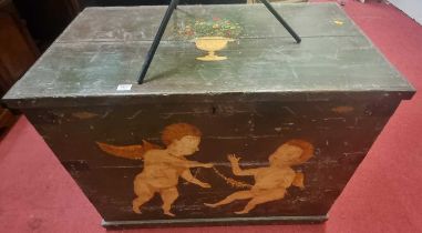 A 19th century Swedish painted planked pine hinge top travelling trunk, decorated with winged