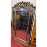 A large contemporary French style gilt framed and bevelled over mantel mirror, having outer marginal