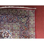 A large Persian blue, red and cream ground Keshan rug, 356 x 353cm (9sq metres) In used but