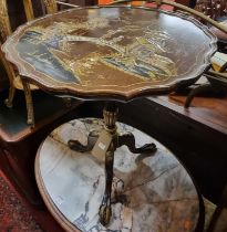 A mahgoany and Japan gilt lacquered piecrust tilt-top pedestal tripod table, depicting typical