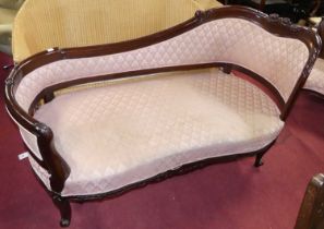 *A contemporary hardwood day bed, the shaped frame with acanthus leaf detail and pink flower head