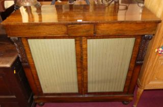 A Regency rosewood chiffonier, having twin blind frieze drawers, over twin lower fabric inset