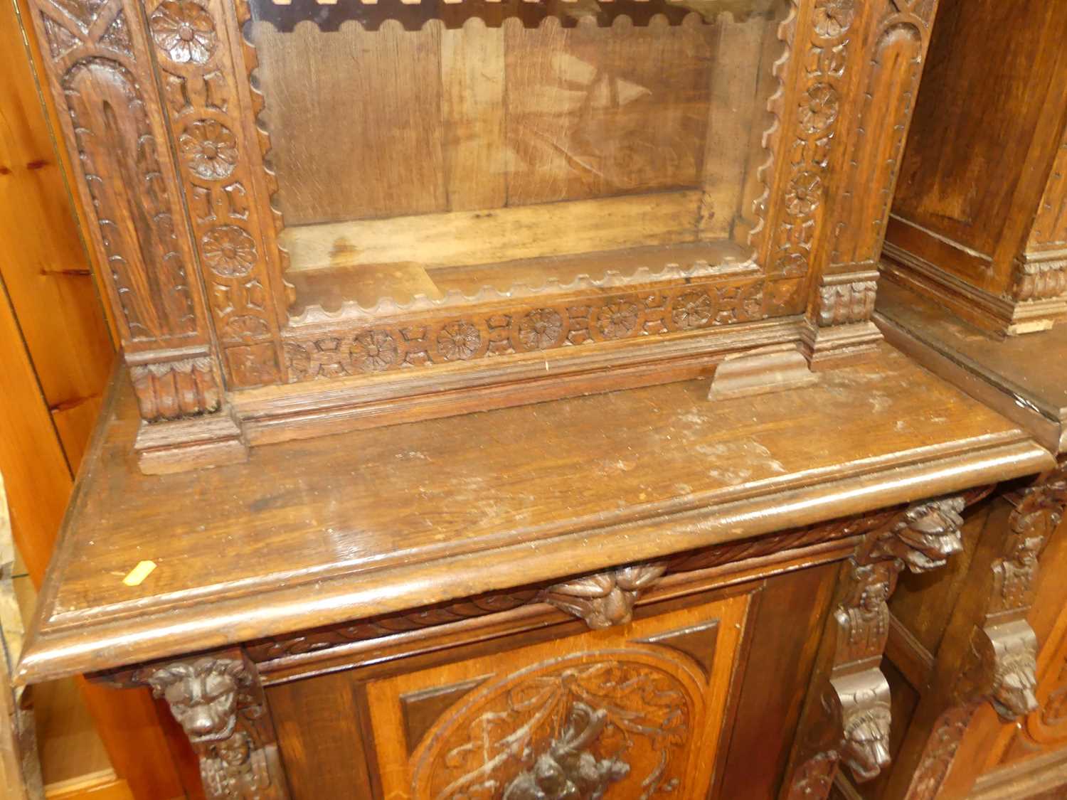 A pair of circa 1900 heavily carved Flemish oak parlour bookcases, each with single glazed upper - Image 4 of 10