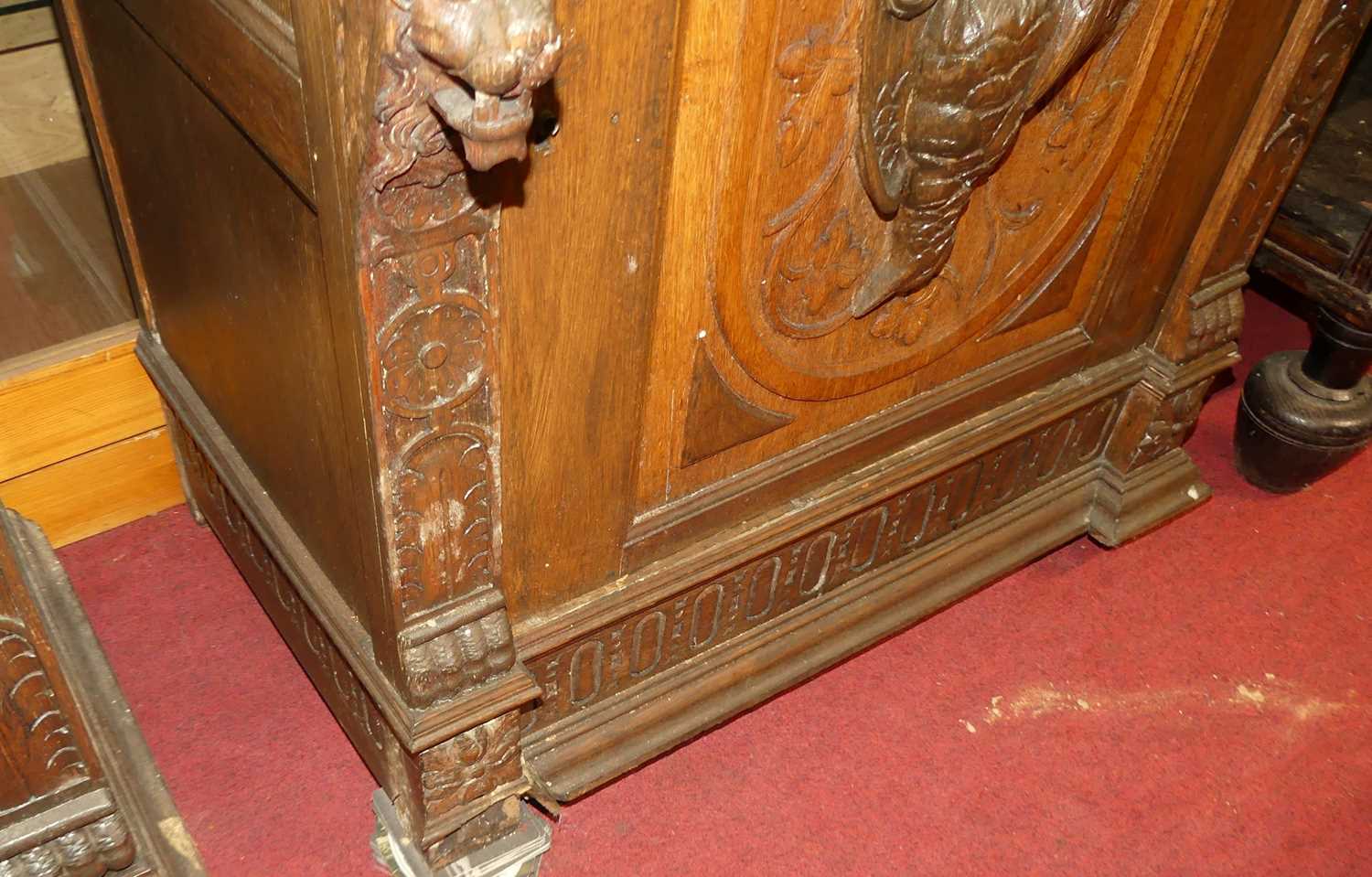 A pair of circa 1900 heavily carved Flemish oak parlour bookcases, each with single glazed upper - Image 6 of 10