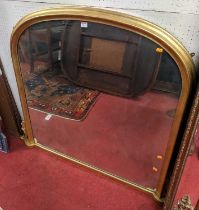 A contemporary gilt framed moulded arched over mantel mirror in the Victorian taste, 117.5 x 138cm
