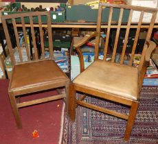 A set of eight Art Deco limed oak slat back dining chairs, each having tan vinyl drop-in pad