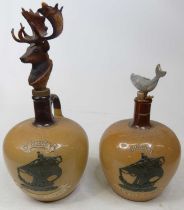Two fruit trays containing a collection of stoneware advertising whisky flagons, to include two