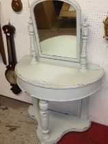 An Edwardian later painted demi-lune swing mirror back wash stand, with shaped platform undertier,