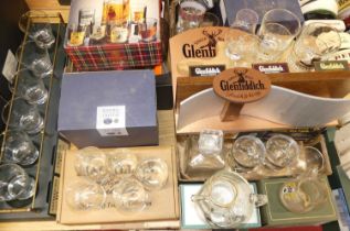 A large selection of whisky related glass ware to include etched tumblers, Haig decanters, and