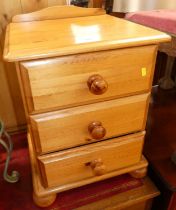 A pair of modern pine ledgeback three drawer bedside chests, width 43cm