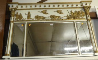 A late Victorian gilt composition and later part painted over mantel mirror, having triptych bevel