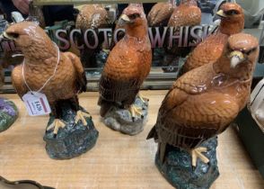 A set of four Royal Doulton for Whyte & McKay Golden Eagle whisky decanters, as modelled by John G