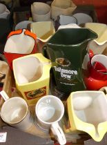 Two fruit trays and contents of assorted advertising whisky jugs to include Tullamore Dew, Black