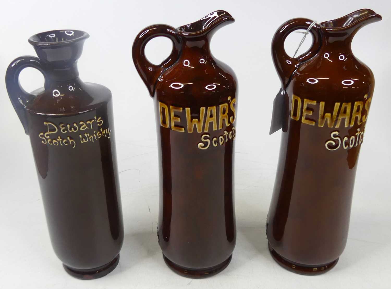 A pair of Doulton Kingsware for Dewars Scotch Whisky ewers, featuring The Nightwatchman, height 27cm - Image 2 of 2