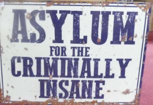 A contemporary laminate on metal wall sign 'Asylum for the criminally insane', 50 x 70cm