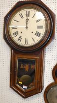 A 19th century American walnut drop trunk wall clock, by the Ansonia Clock Company of New York,