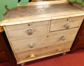 A Victorian pine low chest of two short over two long drawers on turned supports, width 84cm