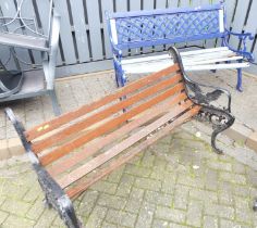 A black painted cast iron ended and part stained slatted wood two-seater garden bench (several