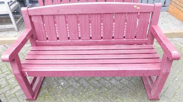 A burgundy painted slatted wood three-seater garden bench, width 153.5cm
