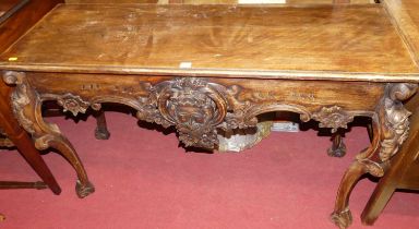 A floral carved hardwood console table, in the Georgian taste, width 136cm