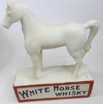 A fruit tray containing a collection of White Horse Whisky ornaments to include a large painted