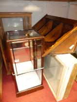 A pine hanging corner cabinet; a hardwood framed table-top mirrored glass display cabinet of
