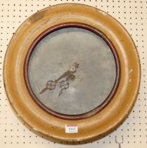 A 19th century French alloy framed circular wall clock, with monopodia and floral surround, together