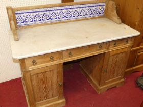 A Victorian ash white marble topped and tile backed kneehole wash stand, having three frieze drawers