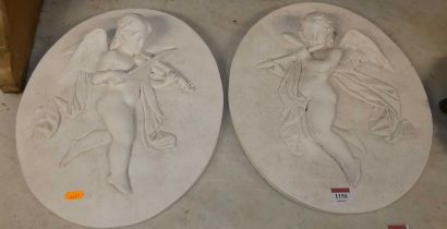 A pair of contemporary plaster oval wall plaques of winged putti playing instruments, 39.5cm x 34cm