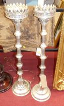 A pair of contemporary chromed metal free-standing pricket sticks in the ecclesiastical taste,