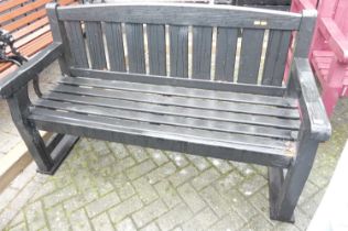 A black painted slatted wood three-seater garden bench, width 153.5cm