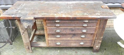 An early 20th century pine work bench, having integral vice and five long graduated drawers, width