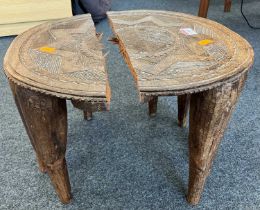 A 20th century African Nubi tribe relief carved hardwood circular wedding stool, dia. 36cm Note: