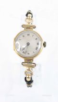 A lady's vintage 18ct gold cased manual wind wristwatch, case dia.24mm, on woven thread bracelet