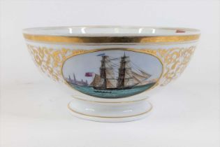 A porcelain footed table bowl, decorated with a three masted ship within gilt cartouche, and further