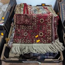 A collection of Indian textiles and a rug