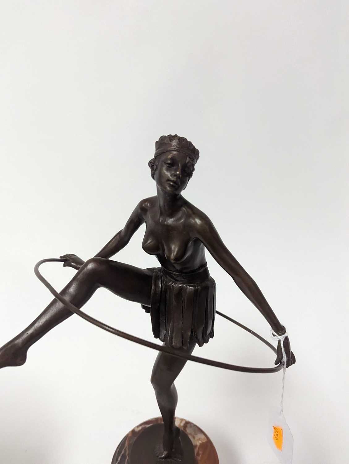 An Art Deco style bronzed metal figure of a dancer, mounted to a cylindrical polished hardstone - Image 2 of 2