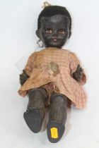 A mid-20th century Pedigree plastic doll, having rolling eyes and showing two front teeth (a/f)